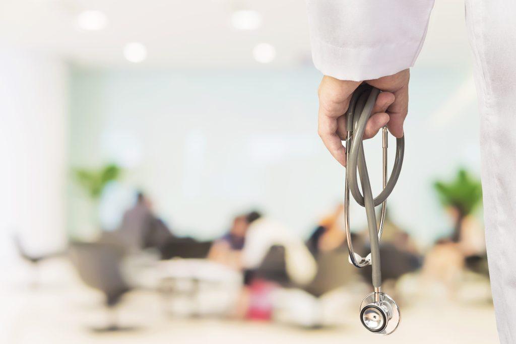 A doctor holding a stethoscope