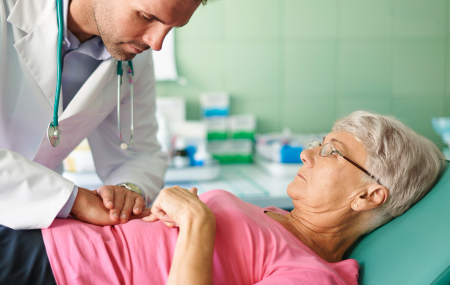 The doctor doing piles treatment of a patient The doctor doing piles treatment of a patient