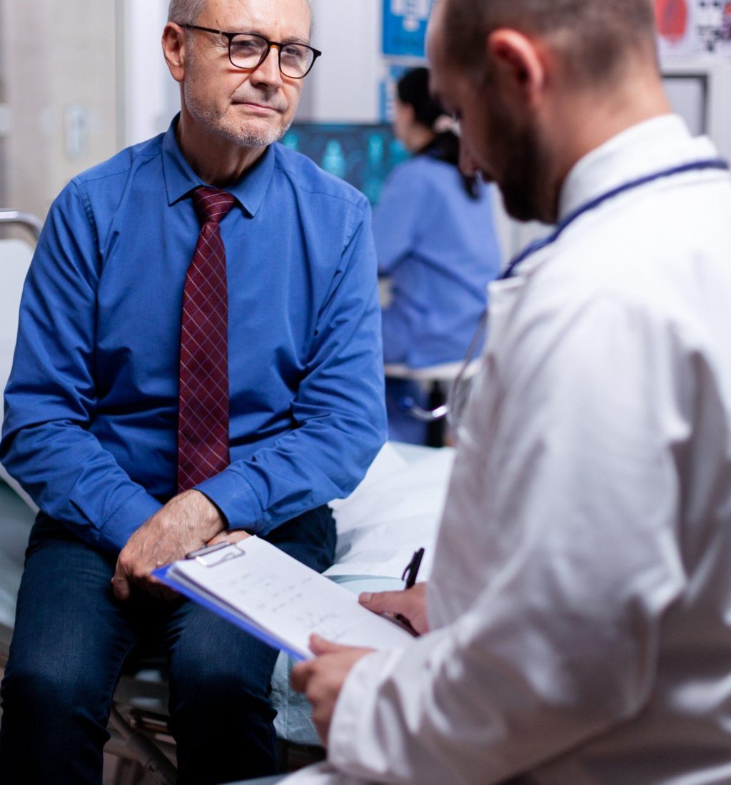 The old man is consulting with a doctor about constipation.
