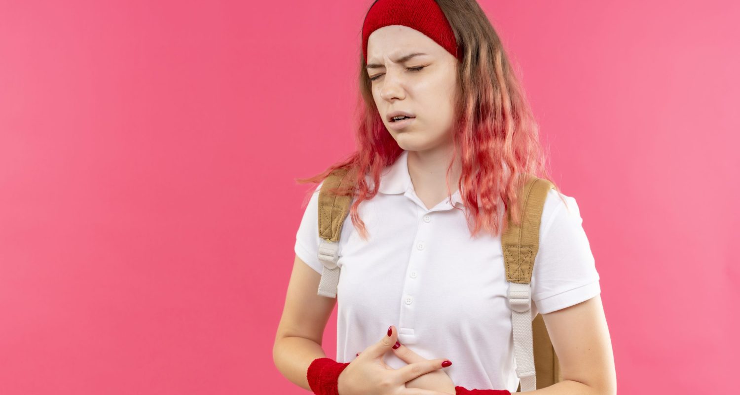 The girl is having pain due to hepatitis B.